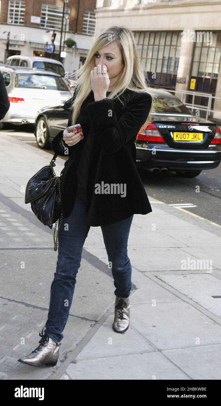 Wearing a frumpy looking outfit, DJ Fearne Cotton leaves BBC Radio 1  sporting a rip in the back of her tights. London, UK. 2/8/11 Stock Photo -  Alamy