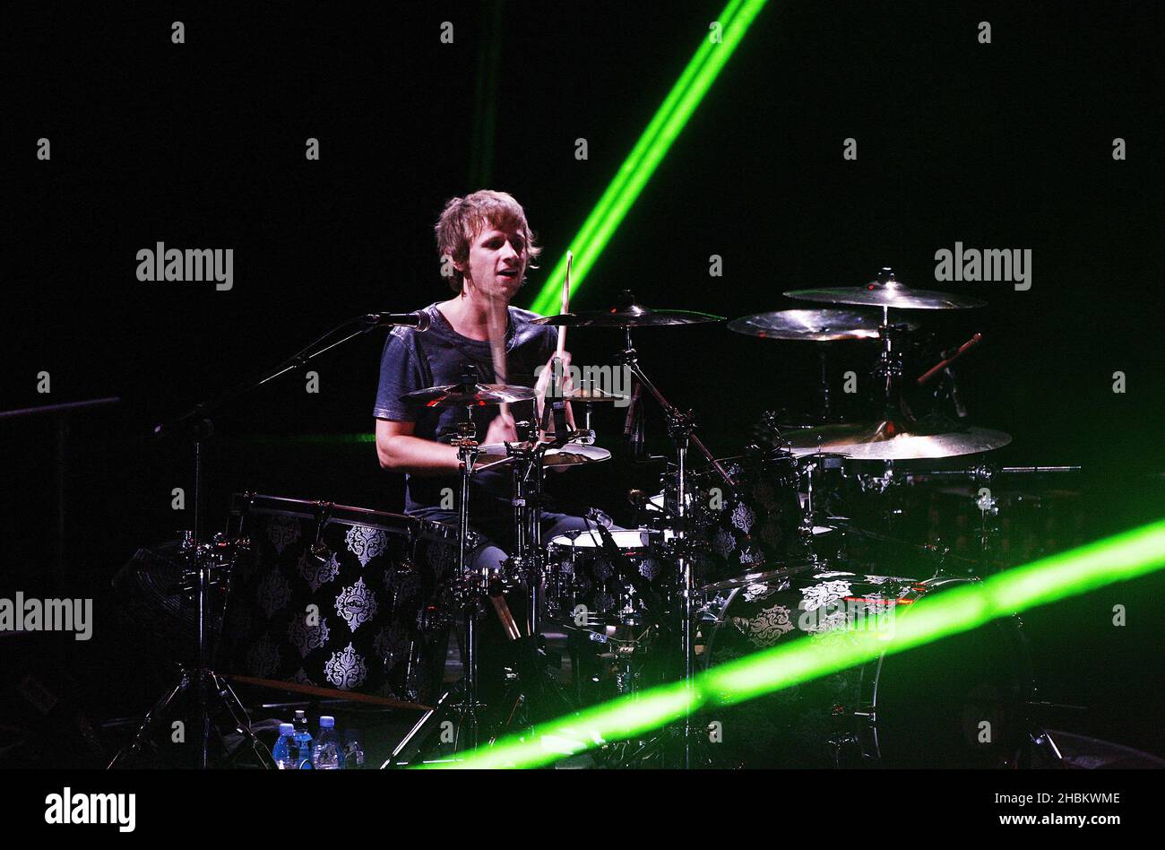 Dominic Howard Of Muse Performs On Stage At The 02 Arena London Stock Photo Alamy