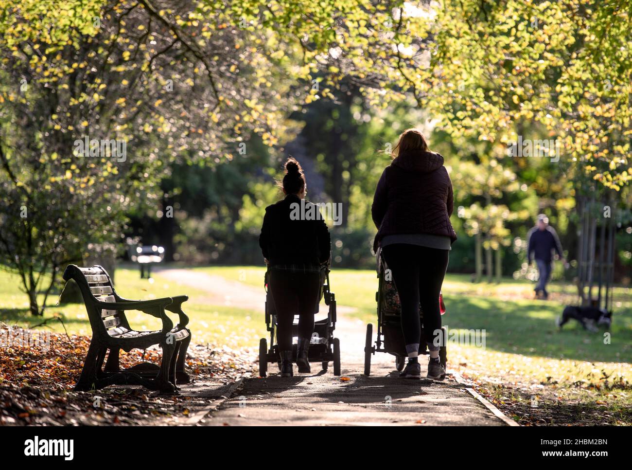 Two young mothers in Collett Park in Shepton Mallet, Somerset, UK Stock Photo