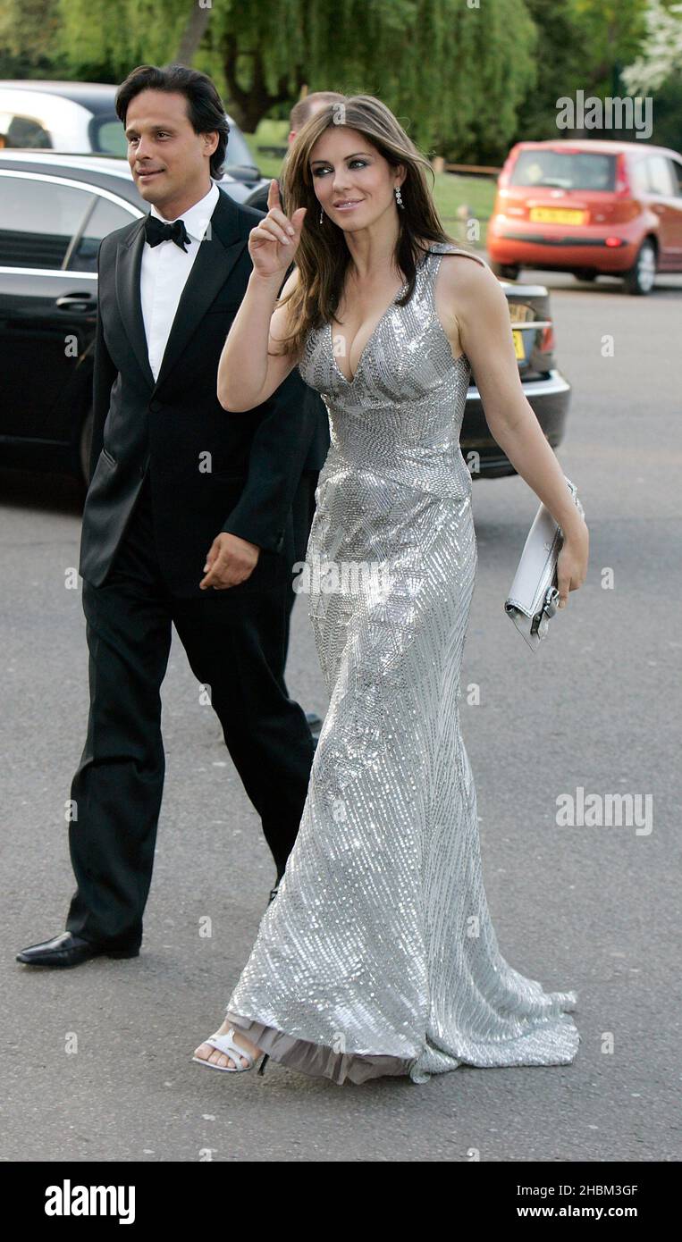 Liz Hurley and husband Arun Nayar arriving at The Caudwell Children Butterfly Ball at Battersea Evolution in south London. Stock Photo