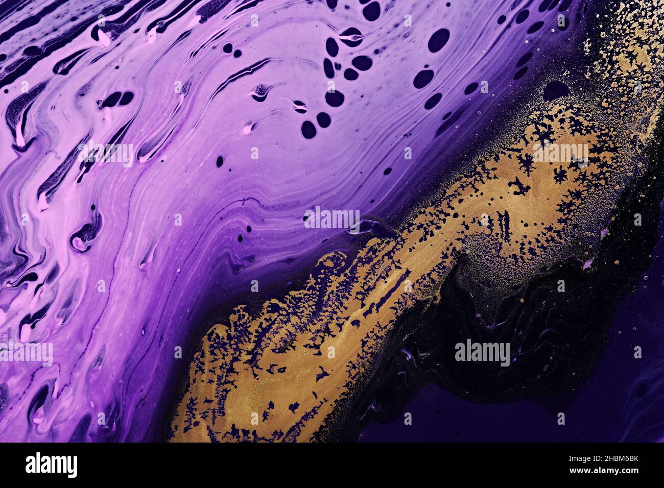 Metallic gold abstraction on purple waves. Fluid Art. Marble effect