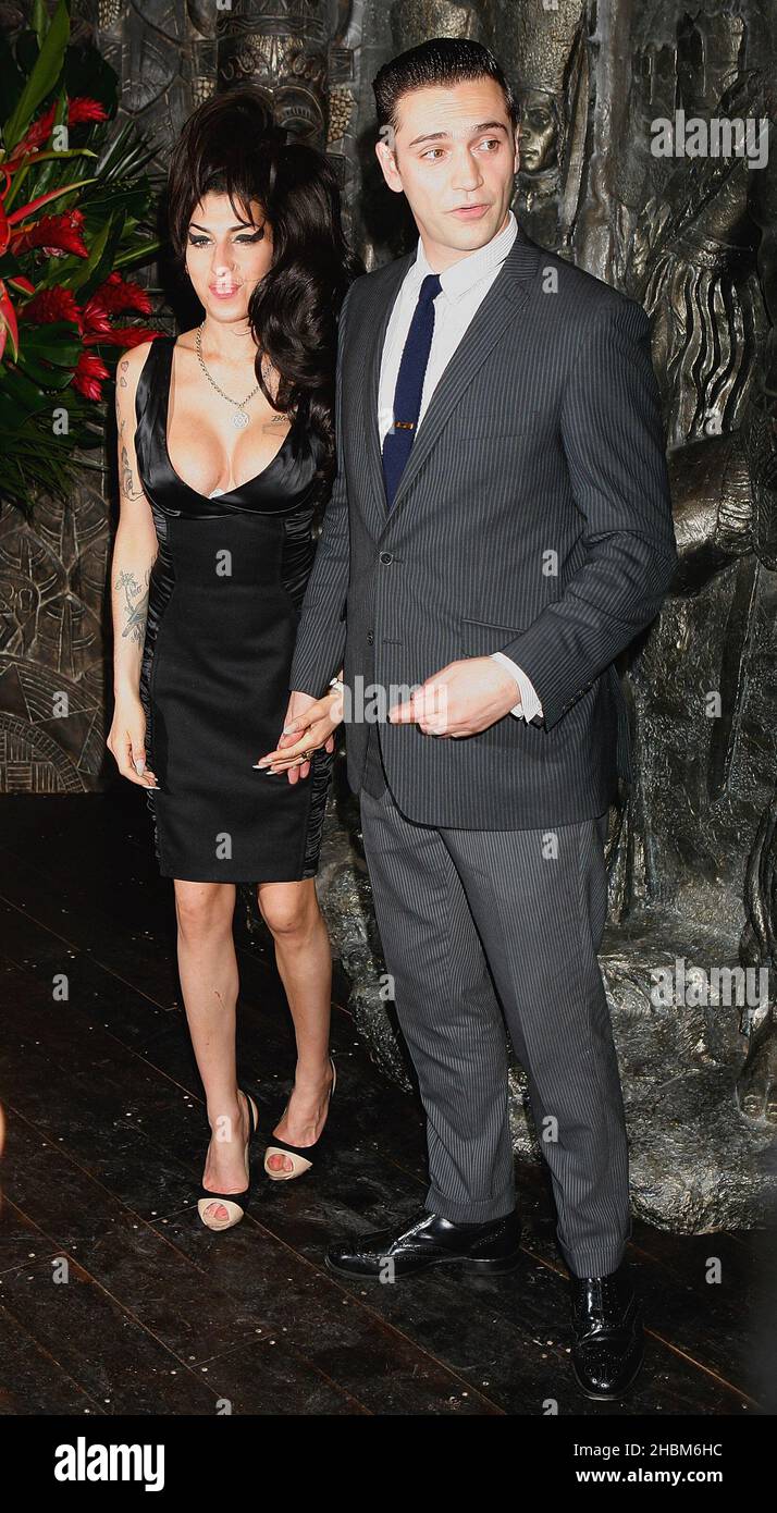 Amy Winehouse and new boyfriend Reg Traviss arrive at the Shaka Zulu shop opening at Staples Market, Camden Town, London Stock Photo