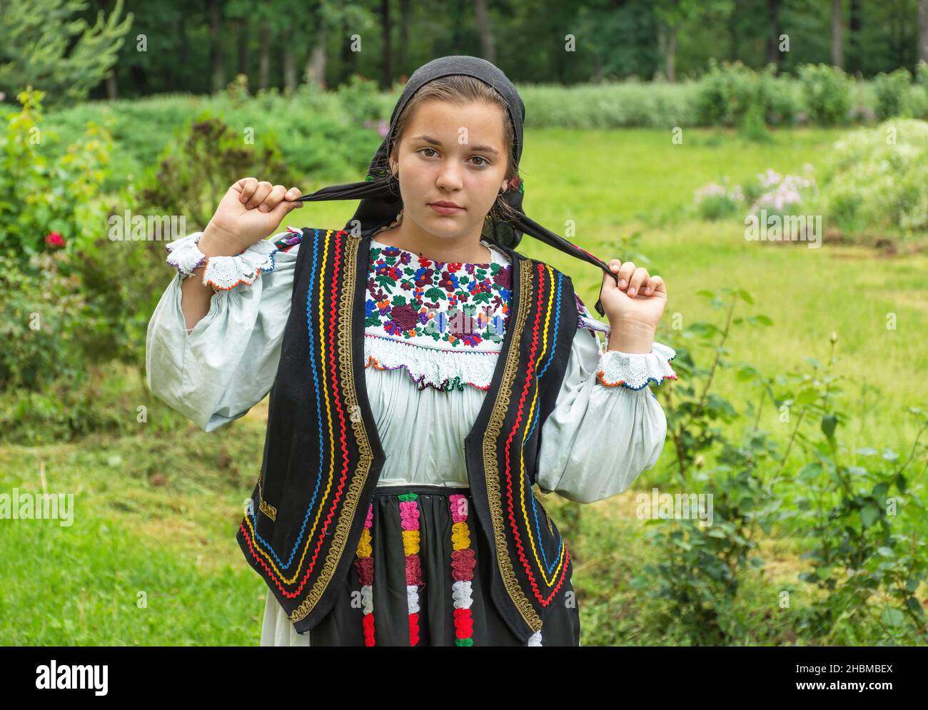 Salaj, Romania-May 15, 2018: outdoor portrait of a young girl wearing  traditional Romanian costume Stock Photo - Alamy