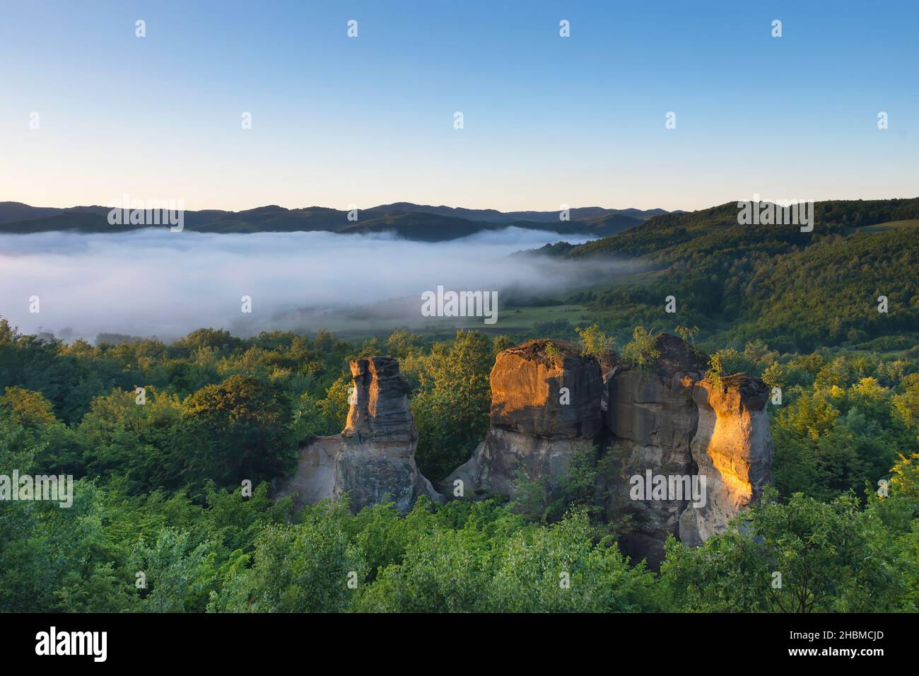 The rock towers of the Dragons Garden (Gradina Zmeilor ), a protected geological nature reserve in Salaj, Transylvania region, Romania, at sunrise Stock Photo