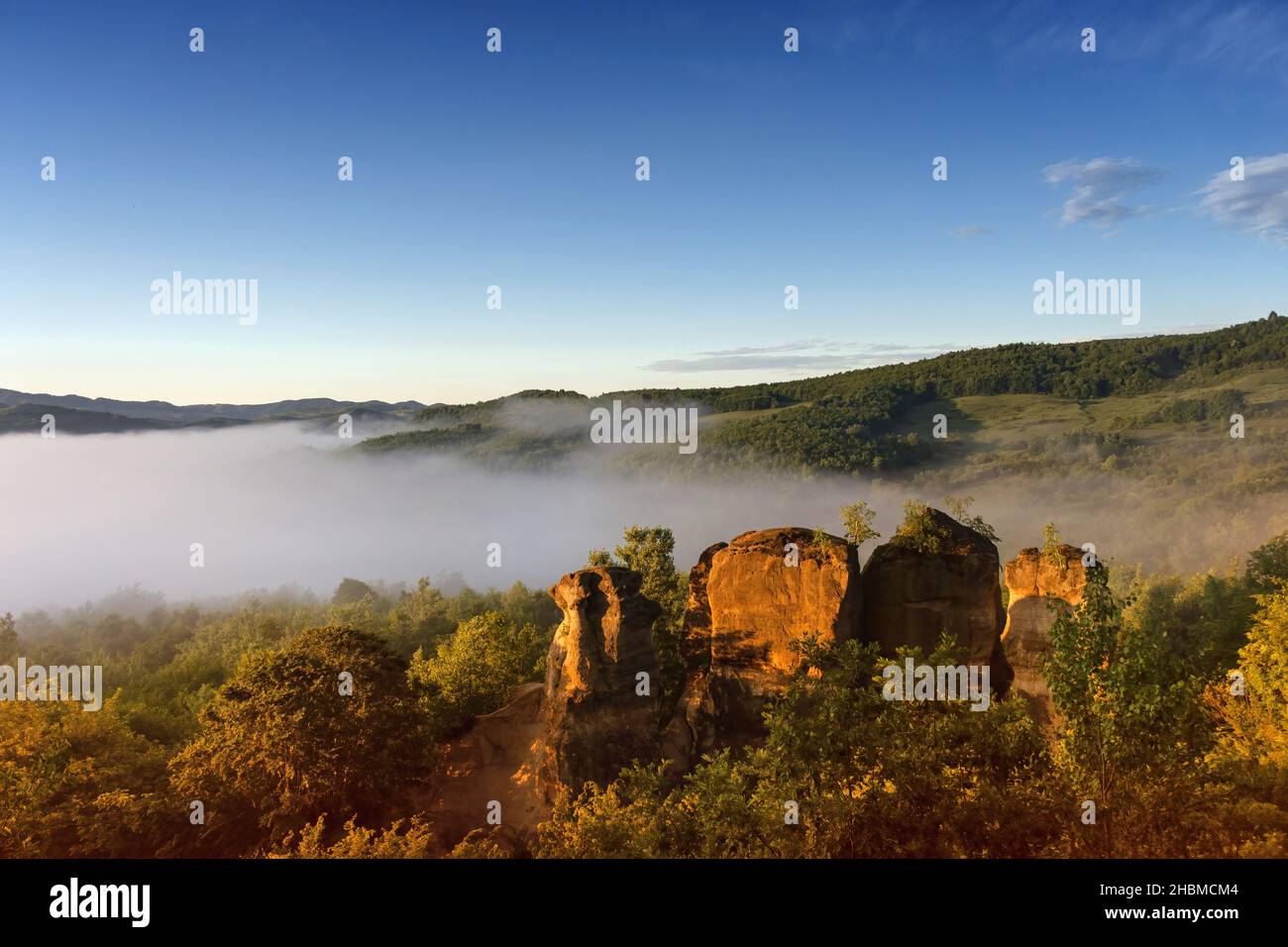 The rock towers of the Dragons Garden (Gradina Zmeilor ), a protected geological nature reserve in Salaj, Transylvania region, Romania, at sunrise Stock Photo