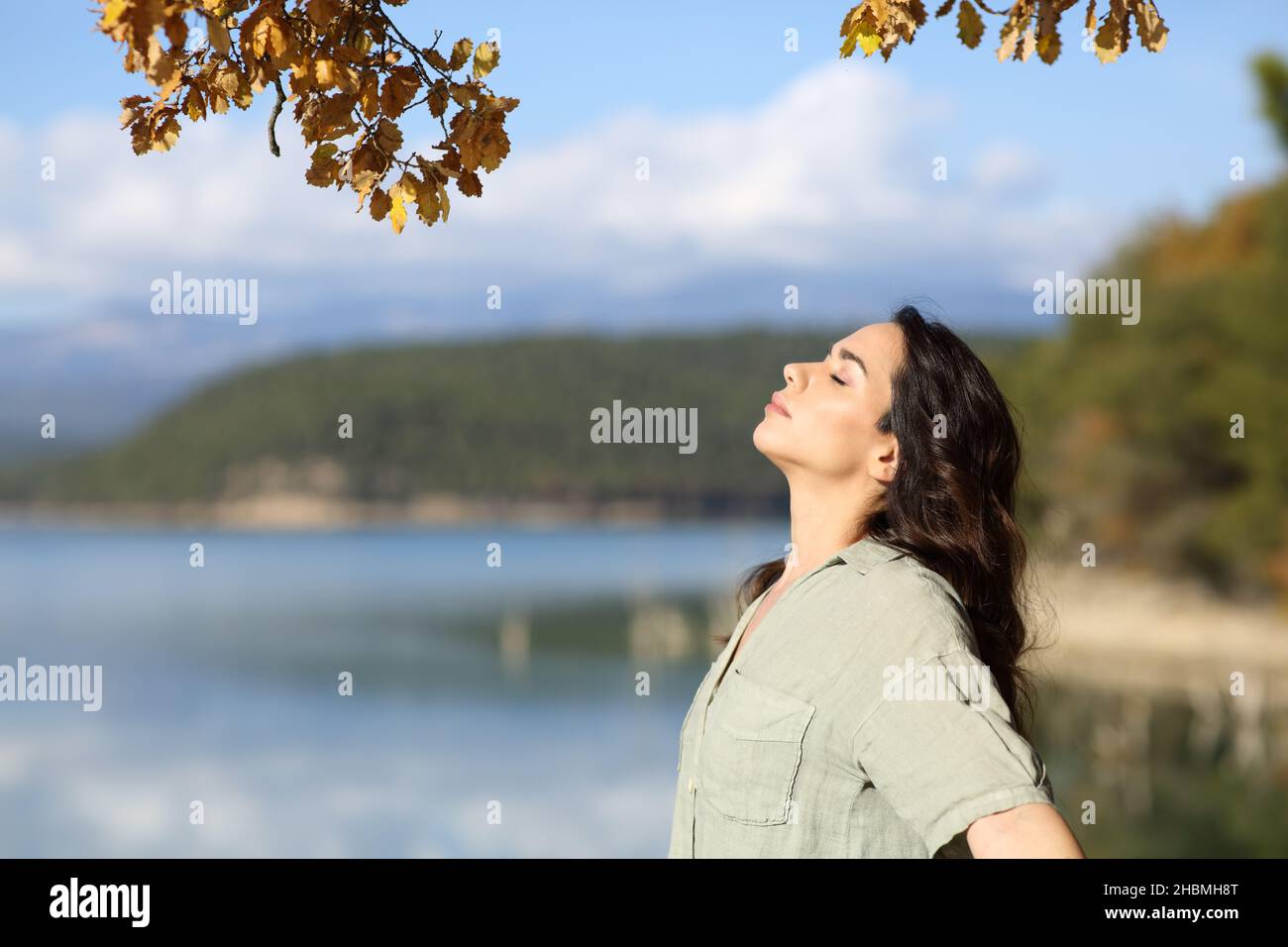 Profile of a relaxed happy woman breathing fresh air in nature Stock ...