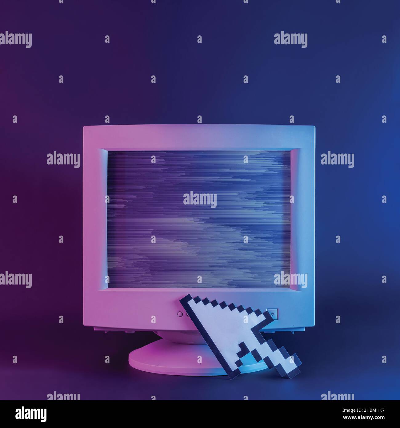 Retro computer monitor with glitch and pixel arrow mouse cursor on neon purple background Stock Photo