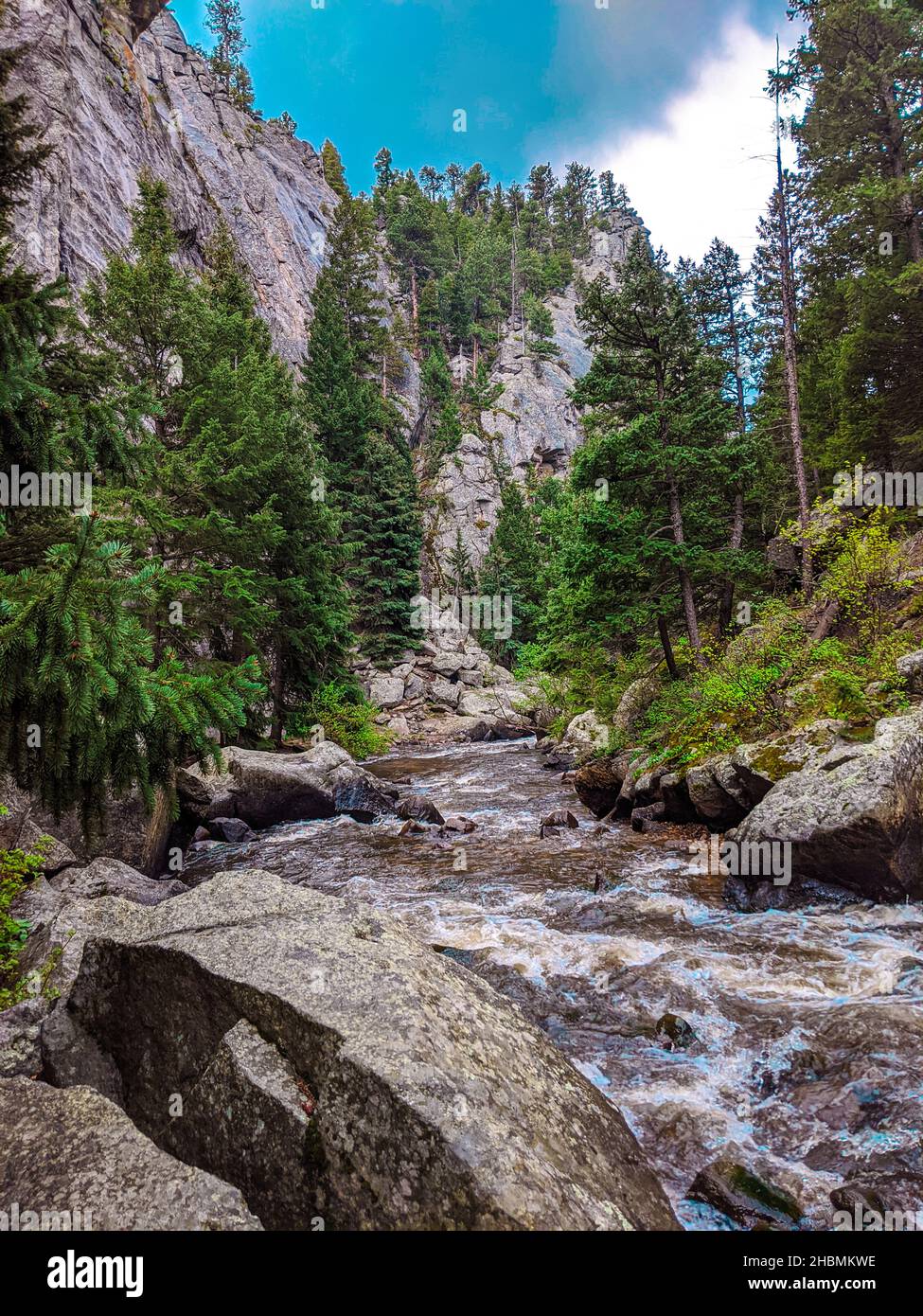 A vertical shot of a waterfall in a forest during the day Stock Photo ...