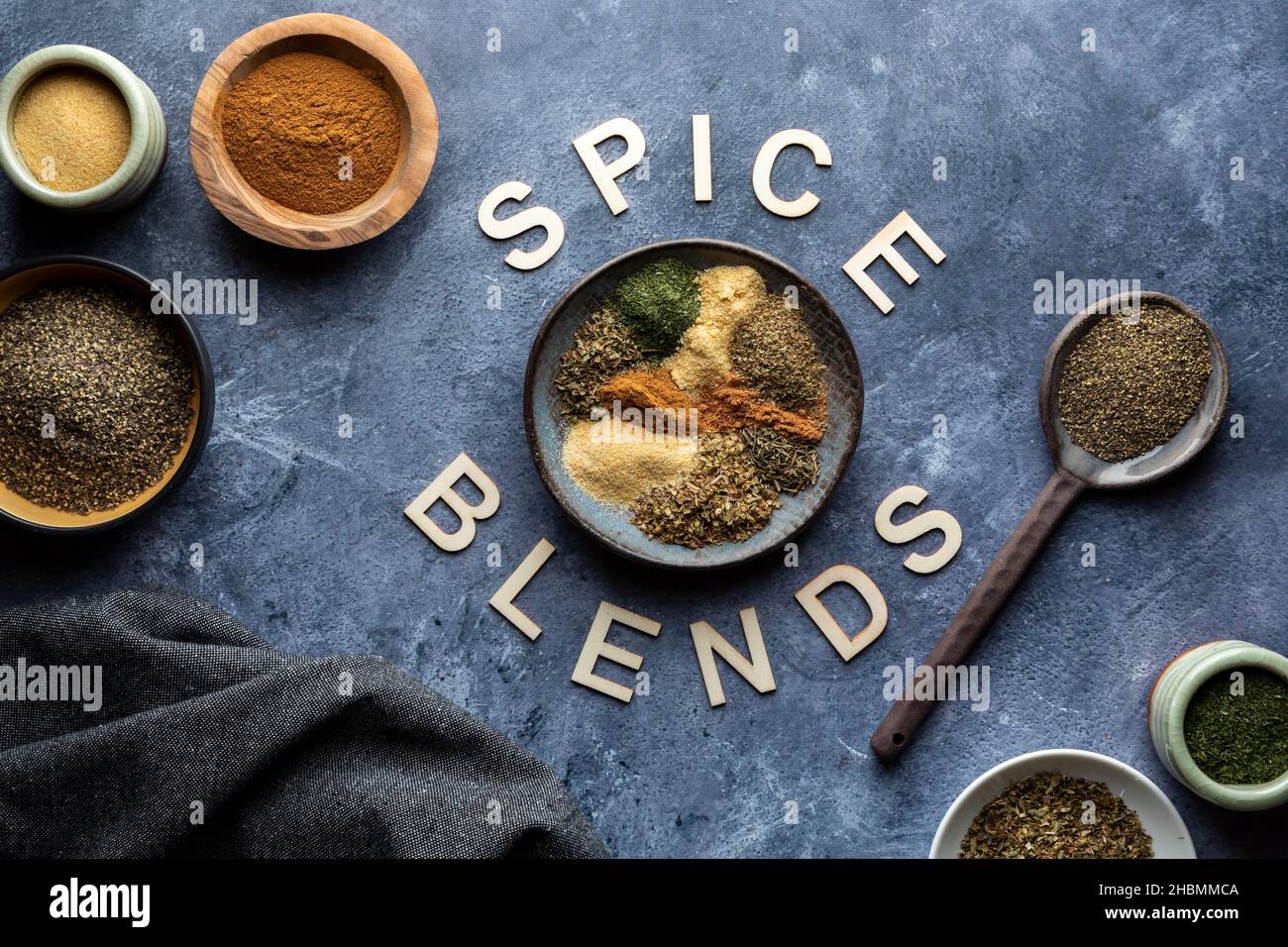Top down view of an assortment of spices used to make a spice blend