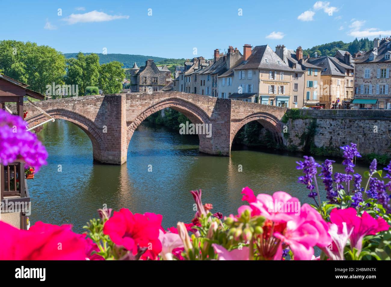 The old bridge of Espalion located in the southwest of France on the Way of St. James in Southwest of France, taken on a sunny summer afternoon, with Stock Photo