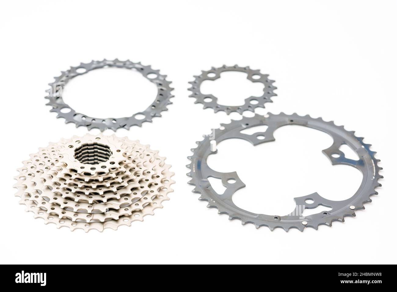Gears, sprockets and chain of a mountain sports bike on a white