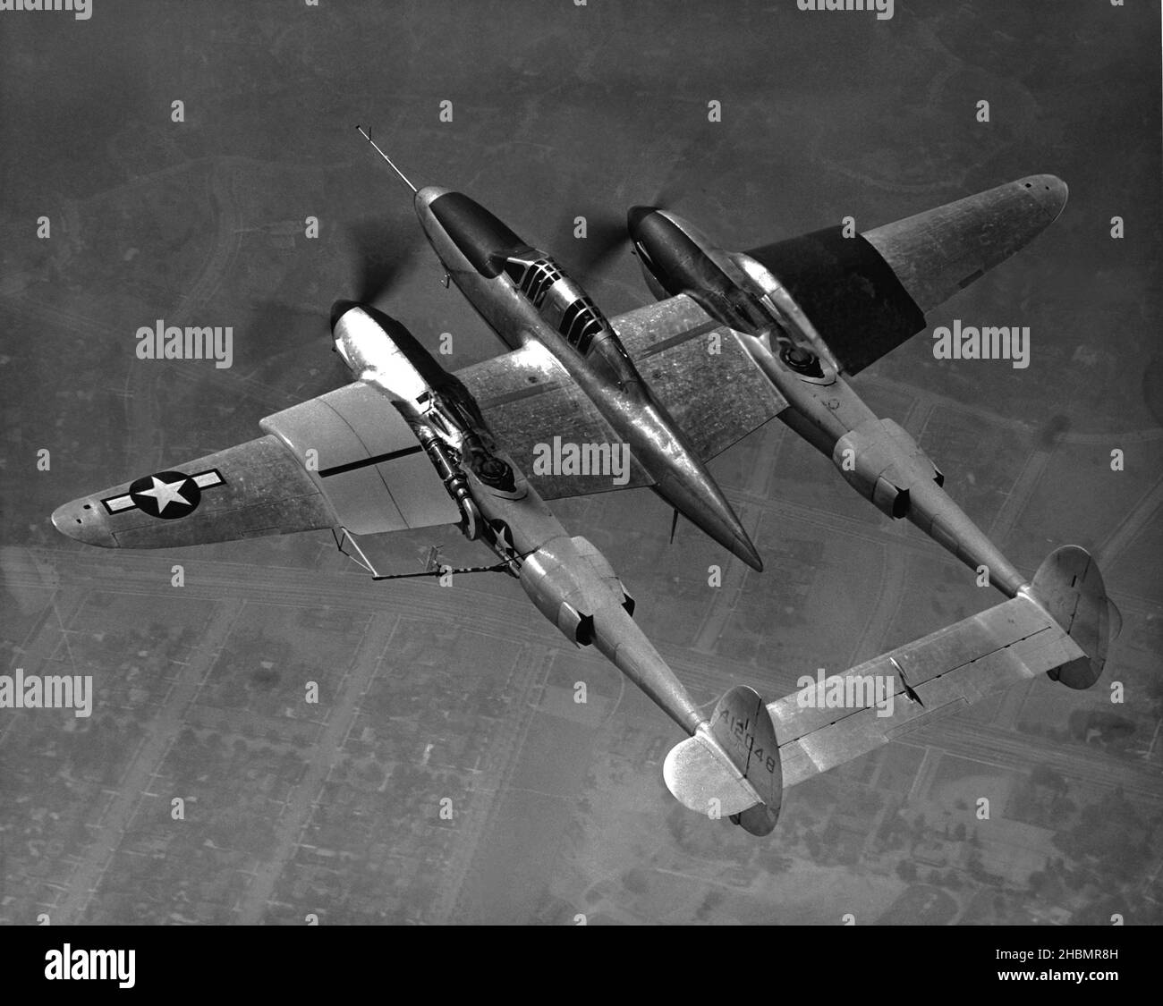 US Air Force fighter jet flying over desert. Shot from above. circa 1965 Stock Photo