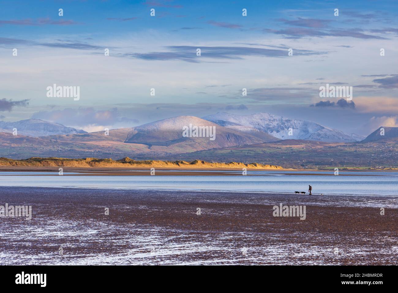 Mount Snowdon and the Snowdonia Mountains from Newborough Beach in the winter, Isle of Anglesey, North Wales Stock Photo