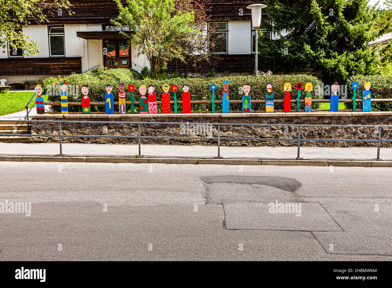 Row of handmade figures in front of a kindergarten in Schliersee, Germany Stock Photo