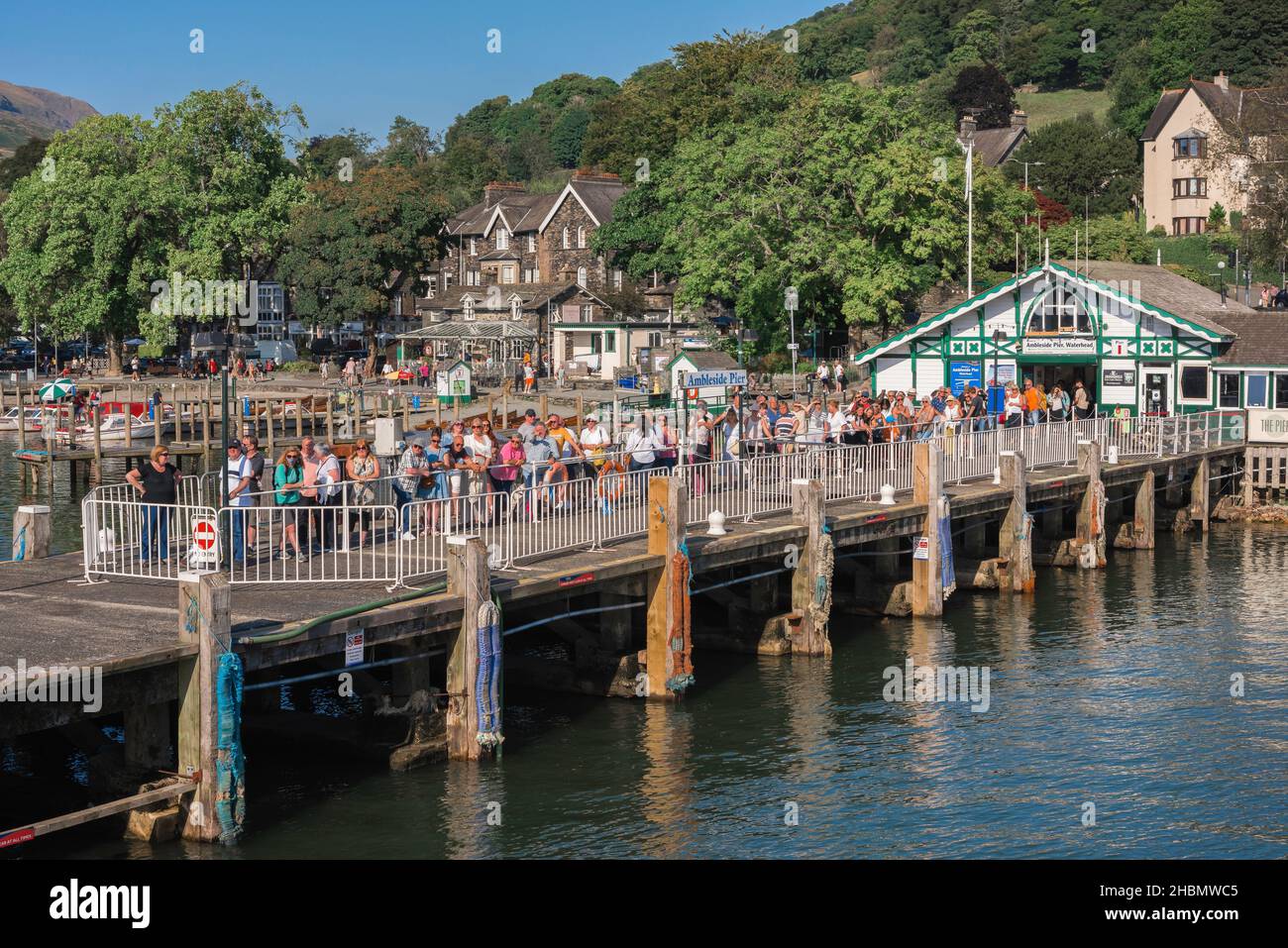 Lake District Tourists View In Summer Of People On Ambleside Pier lake-district-tourists-view-in-summer-of-people-on-ambleside-pier