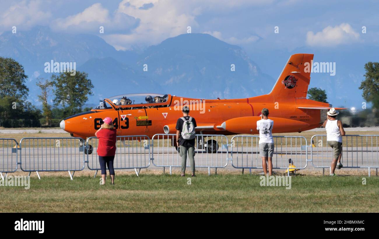 Rivolto del Friuli Italy SEPTEMBER, 17, 2021 Historic military jet trainer airplane in front of the public of an airshow. Aermacchi MB-326 by Volafeni Stock Photo