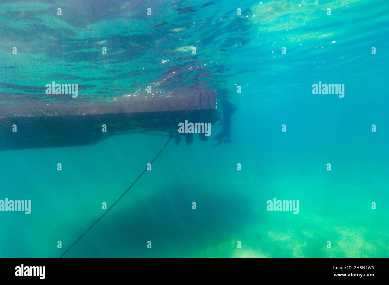 Submerged view of dive boat ladder anchor line and bottom of Lake Superior Stock Photo