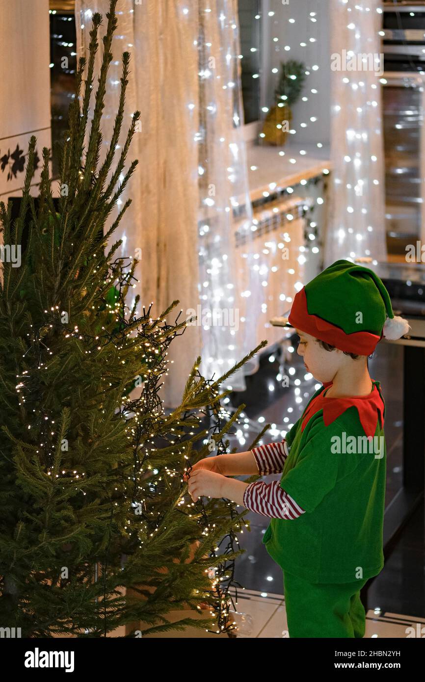 Dectrorting Little Tree Little kids decorating Christmas tree at home Stock Photo - Alamy