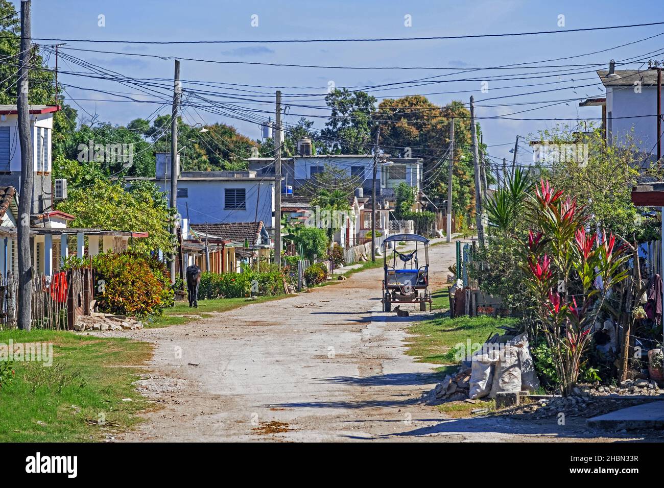 Dirt road running through rural village in the countryside of the Villa Clara Province on the island Cuba, Caribbean Stock Photo