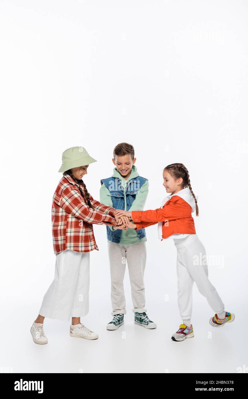Adorable smiling kids holding hi-res stock photography and images - Alamy