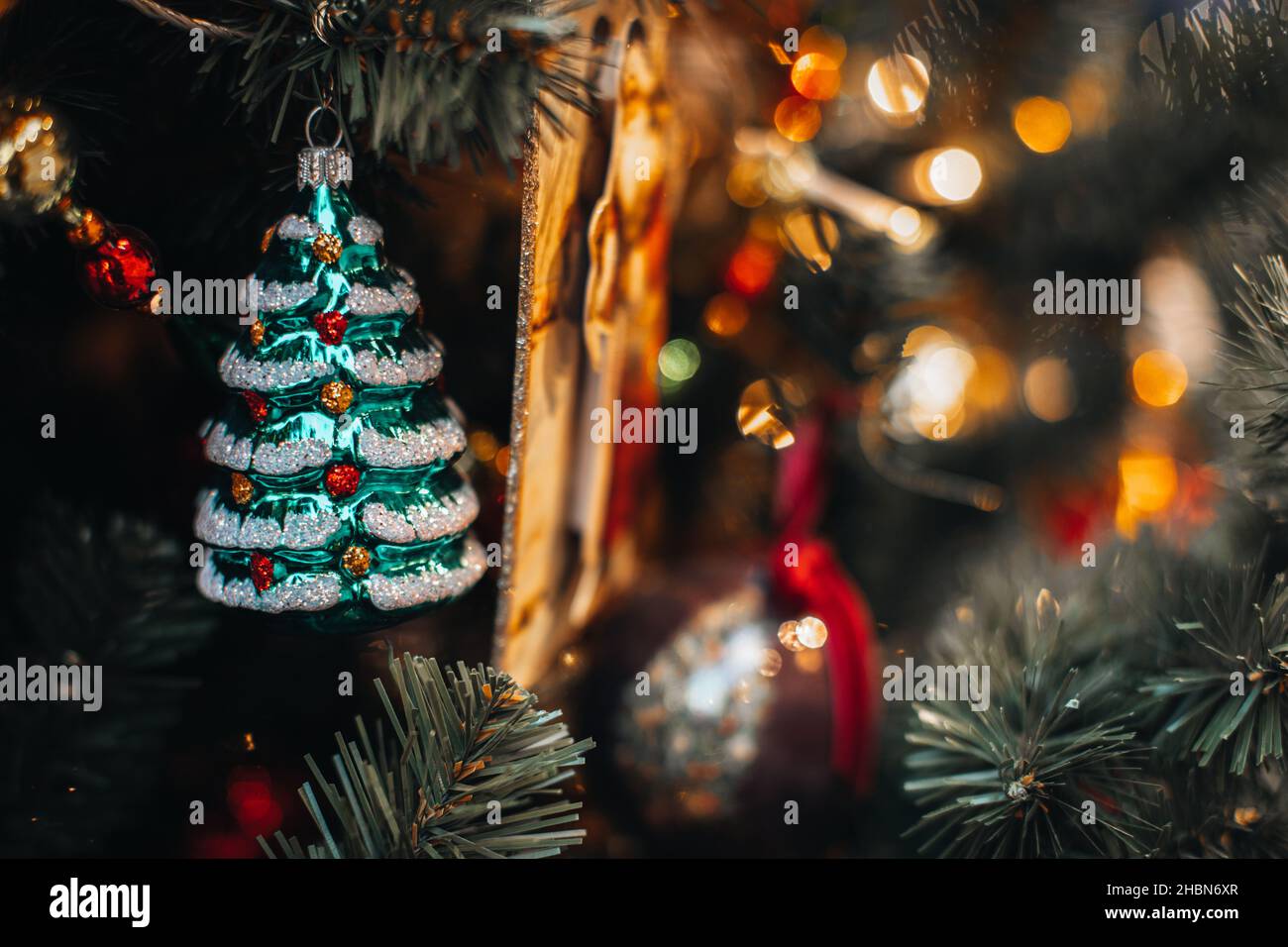 Vintage Christmas toy figurine of glass Christmas tree. New Year festive magic details. Retro style Stock Photo