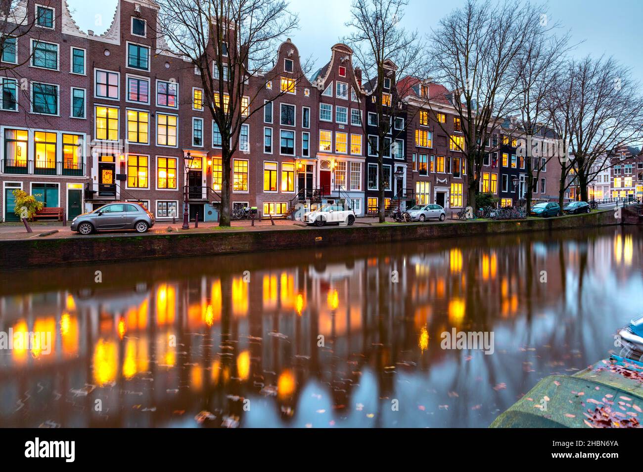 Evening Amsterdam canal Leidsegracht with typical dutch houses at gold hour, Holland, Netherlands. Stock Photo