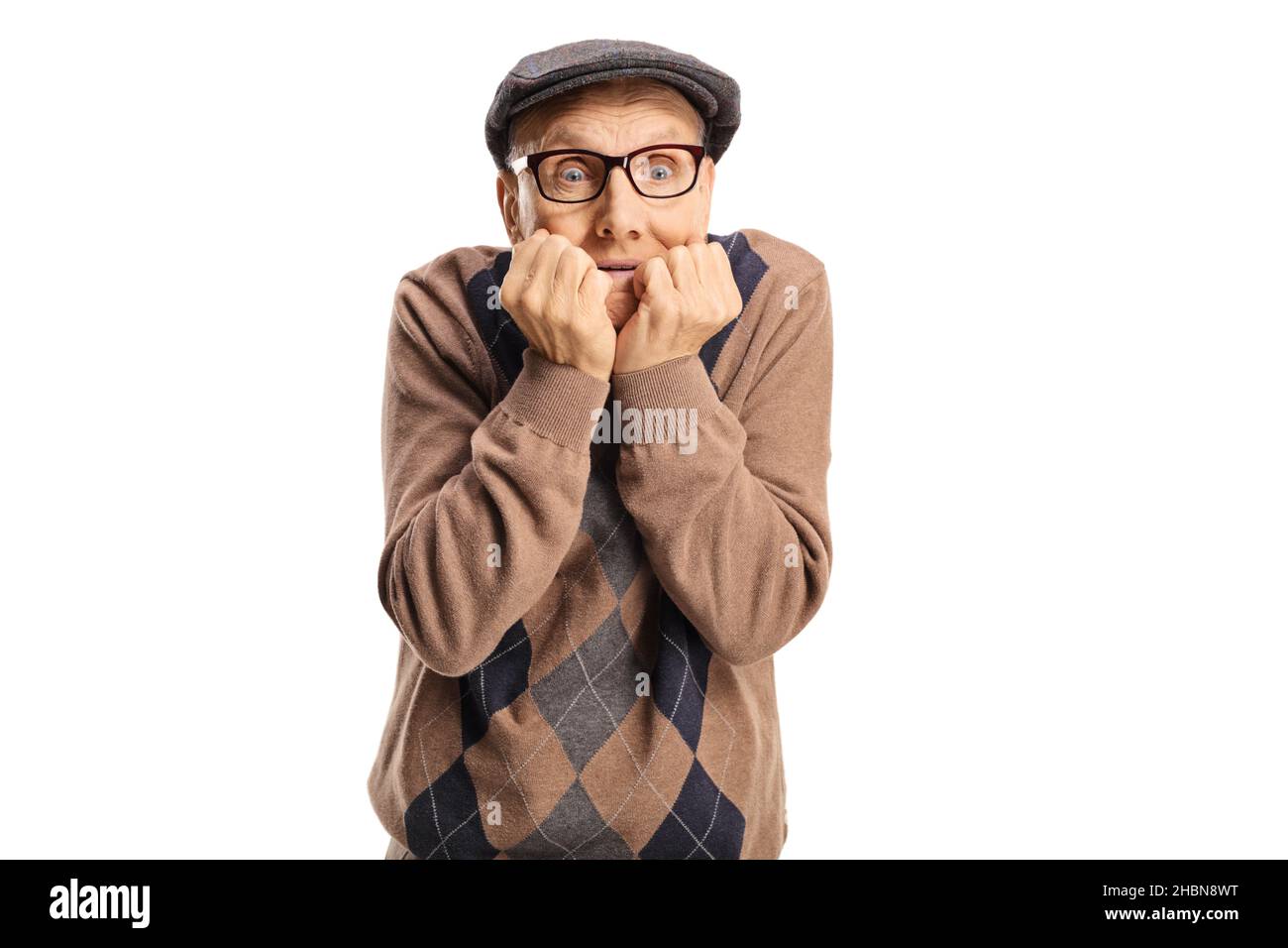 Terrified elderly man with eyes wide open isolated on blue background Stock Photo