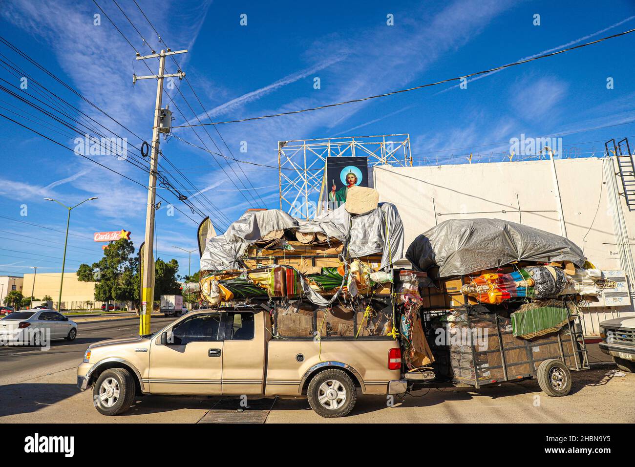 Religious images of the Virgin Mary, San Judas Tadeo and Santa Muerte for sale at the El Resplandor store in the Choyal neighborhood in Hermosillo. Dec 2021. Images are transported in the box and trailer of a pick up wrapped or papered. (Photo by Luis Gutierrez / Norte Photo) Imagenes religiosas de la Virgen  Maria, San Judas Tadeo y la Santa Muerte de venta en la tieda El Resplandor en la colonia Choyal  en Hermosillo . dic 2021. imagenes son trasportadas en la caja y remolque de un pick up envueltas o empapeladas.     (Photo by Luis Gutierrez/Norte Photo) Stock Photo