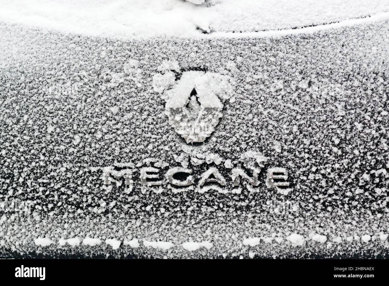 Moscow, Russia - December 13, 2021: Snowy Hood of a brand car Renault Megane. Renault Group - French Automobile Corporation, which is part of the Alli Stock Photo