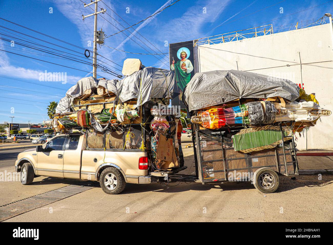 Religious images of the Virgin Mary, San Judas Tadeo and Santa Muerte for sale at the El Resplandor store in the Choyal neighborhood in Hermosillo. Dec 2021. Images are transported in the box and trailer of a pick up wrapped or papered. (Photo by Luis Gutierrez / Norte Photo) Imagenes religiosas de la Virgen  Maria, San Judas Tadeo y la Santa Muerte de venta en la tieda El Resplandor en la colonia Choyal  en Hermosillo . dic 2021. imagenes son trasportadas en la caja y remolque de un pick up envueltas o empapeladas.     (Photo by Luis Gutierrez/Norte Photo) Stock Photo