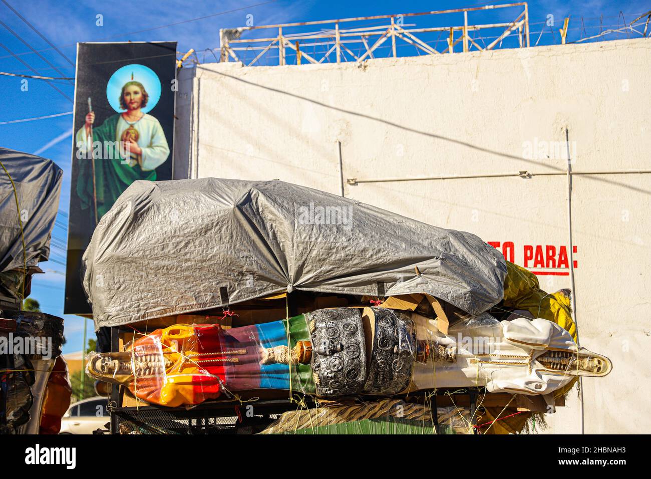 Religious images of the Virgin Mary, San Judas Tadeo and Santa Muerte for sale at the El Resplandor store in the Choyal neighborhood in Hermosillo. Dec 2021. Images are transported in the box and trailer of a pick up wrapped or papered. (Photo by Luis Gutierrez / Norte Photo) Imagenes religiosas de la Virgen  Maria, San Judas Tadeo y la Santa Muerte de venta en la tieda El Resplandor en la colonia Choyal  en Hermosillo . dic 2021. imagenes son trasportadas en la caja y remolque de un pick up envueltas o empapeladas.     (Photo by Luis Gutierrez/Norte Photo) Stock Photo