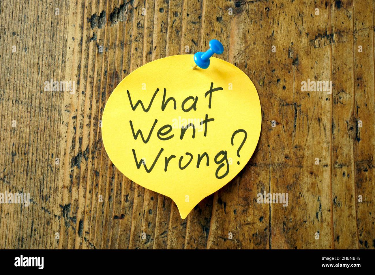 Memo stick with phrase What went wrong. Stock Photo