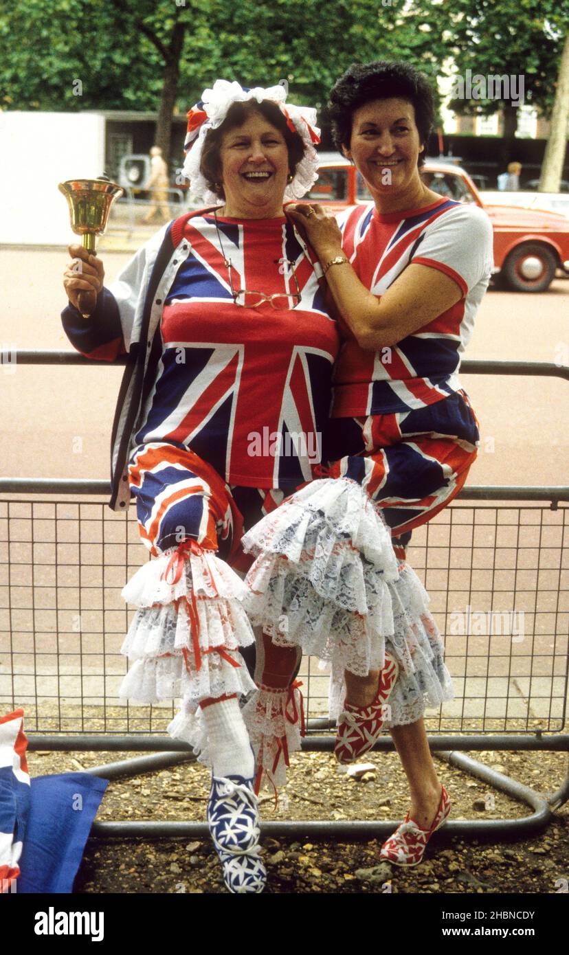 Patriotic supporters of the Royal family wearing Union Jack outfits along The Mall for the wedding of Prince Andrew and Sarah Ferguson 23 July 1986 Stock Photo