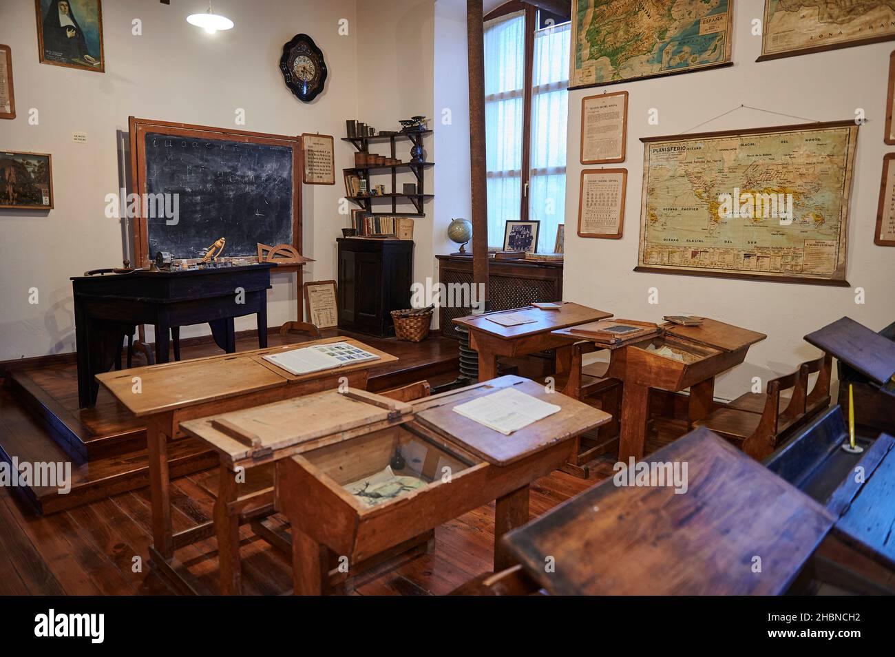 Vintage school class with typical wooden desktop and benches in the ethnographic museum of Artziniega, Alava, Basque Country Stock Photo