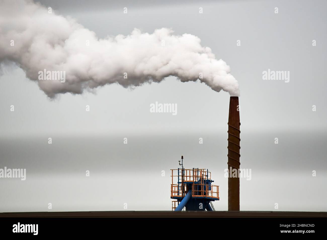 Harmful emissions from the plant chimney Stock Photo