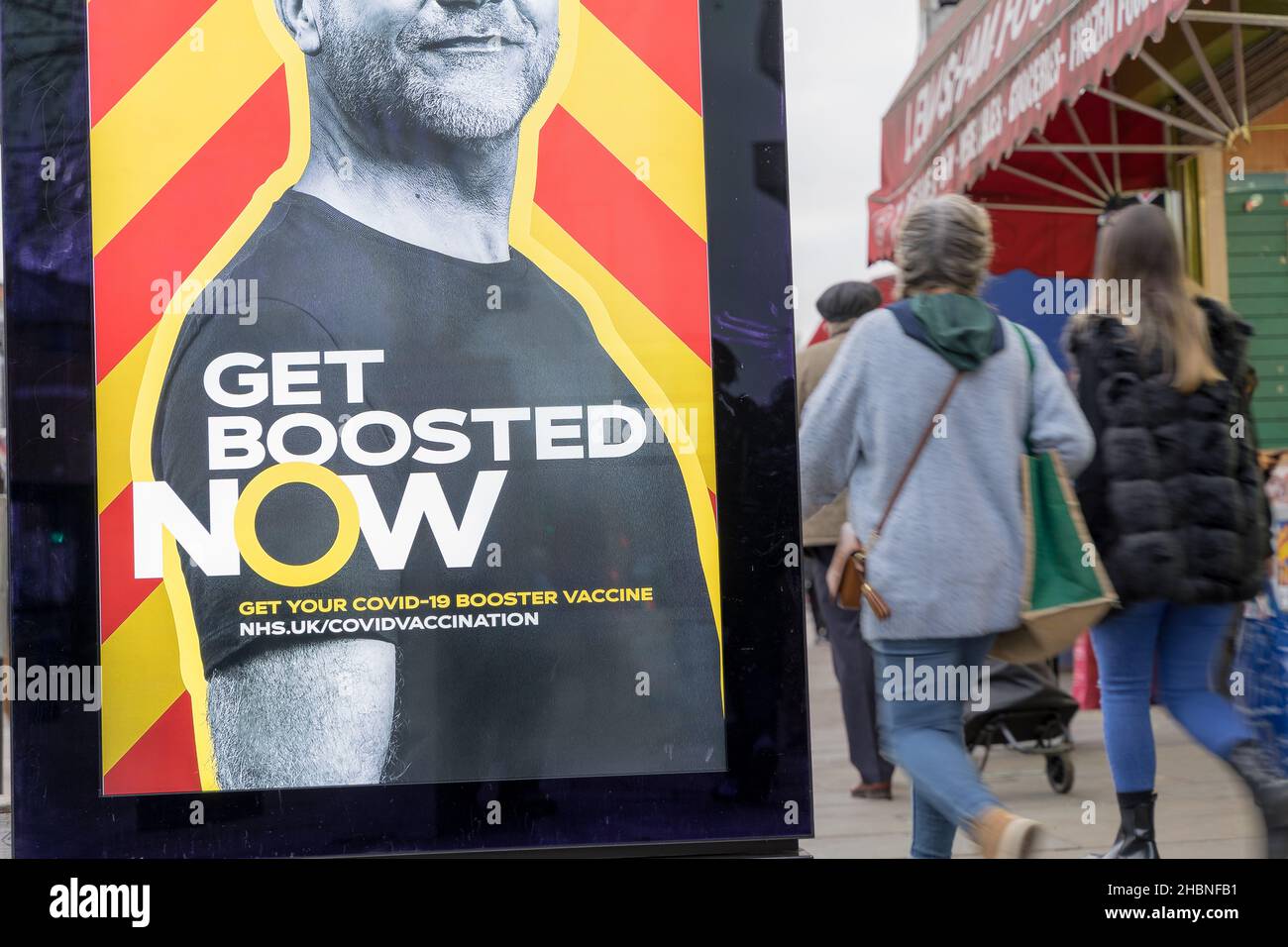Get Boosted Now posters pop up in Lewisham town centre urging people to take up covid-19 booster jab before the end of the year. Stock Photo