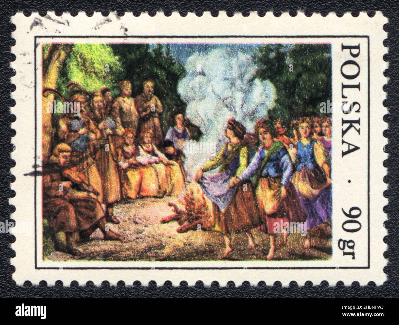 A stamp printed in Poland shows Folkl scene around the night campfire, Poland, 1970 Stock Photo