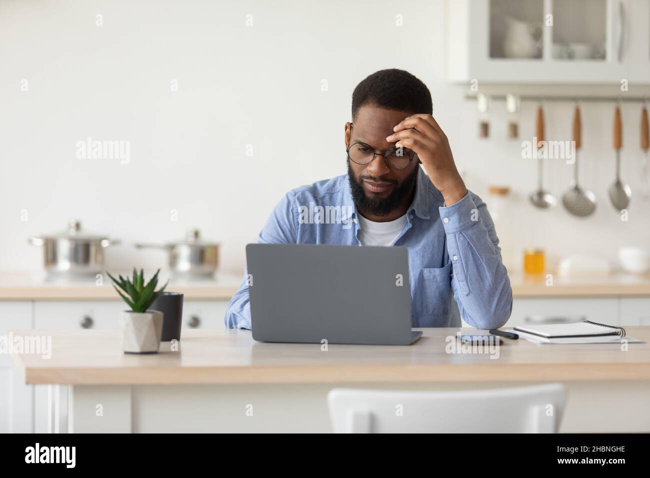 Pensive sad african young man hi-res stock photography and images - Alamy