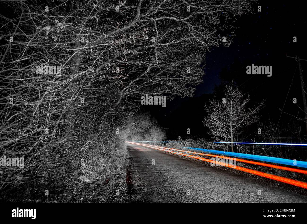 A rally car passing photographed at night in Hampshire, UK Stock Photo