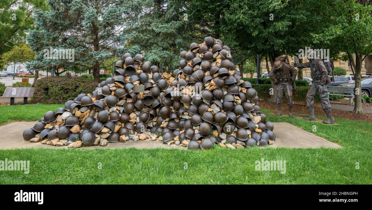 Zanesville, OH - Sept. 8, 2021: This pile of helmets and bronze figures are part of the WWII Korean War Memorial honoring the fallen men from Muskingu Stock Photo