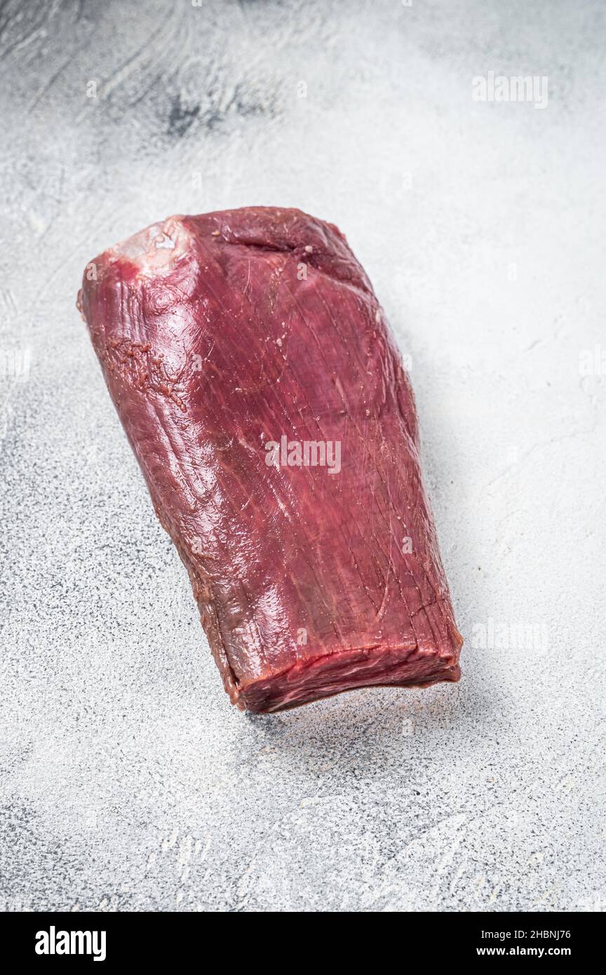 Beef Tenderloin raw meat on butcher table. White background. Top view ...