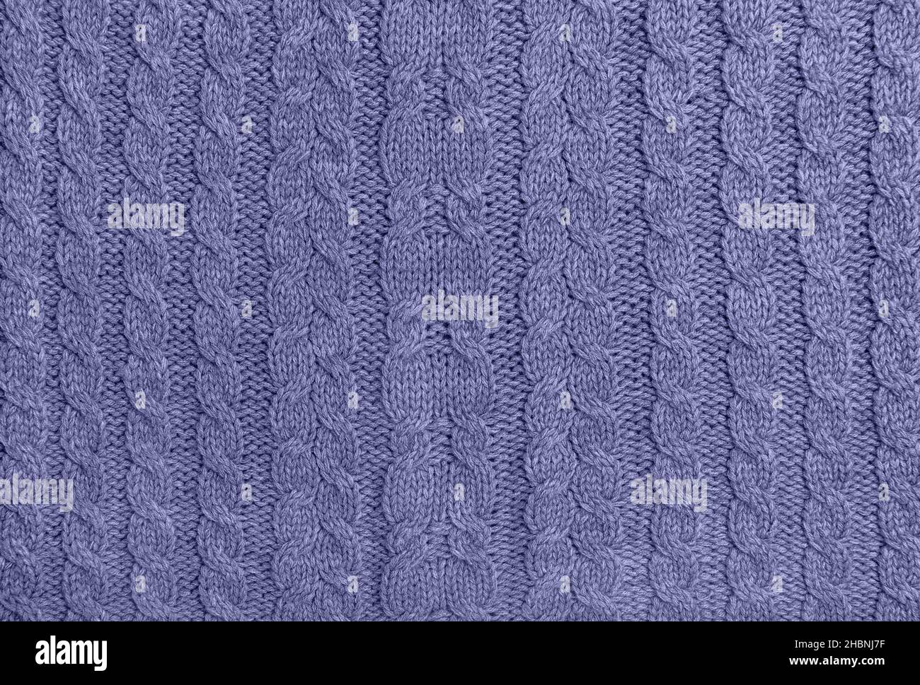 Violet very peri colored knitted wool background. Knitting pattern Stock Photo