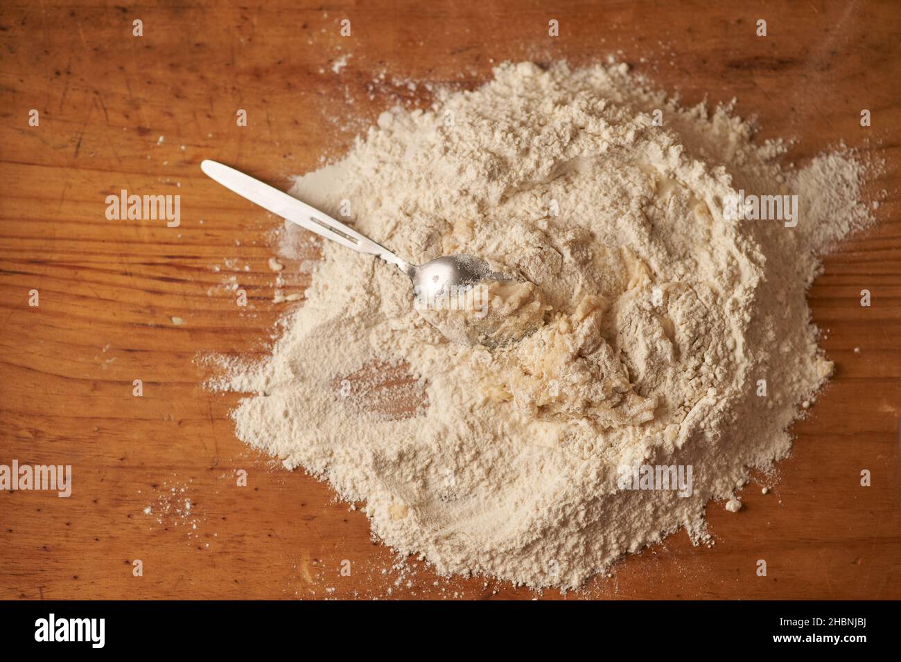flour volcano for dough preparation before kneading Stock Photo