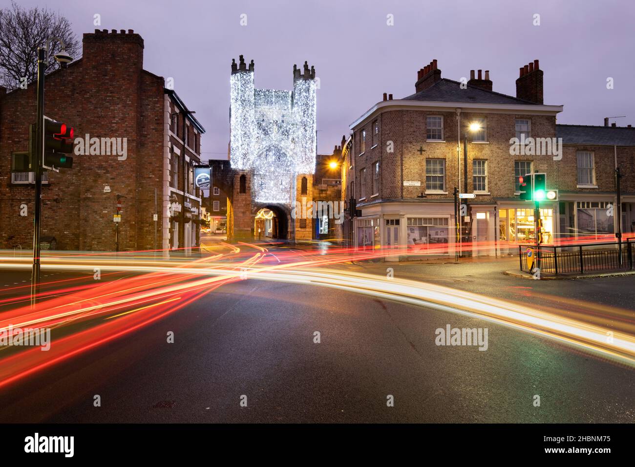 Traffic light trails and christmas lights on Monkbar, York, Yorkshire Stock Photo
