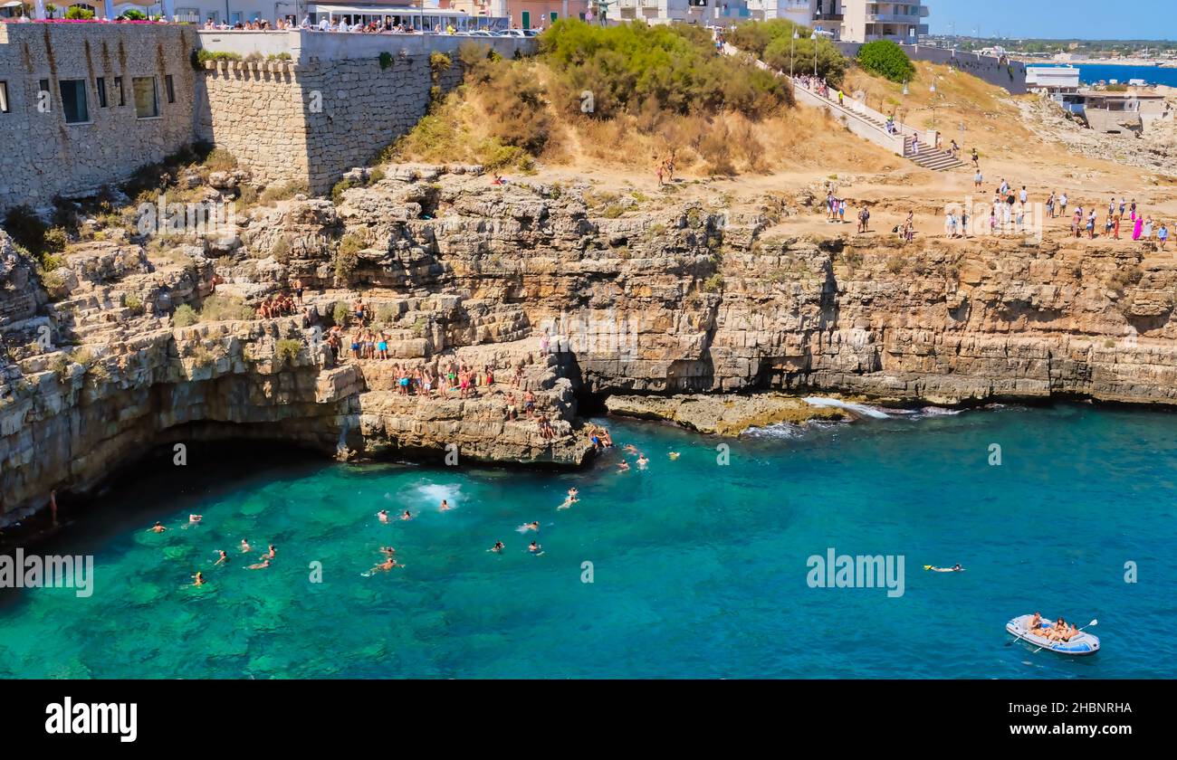 Polignano a Mare, Southern Italy province of Bari - famous beach Lama Monachile between steep cliffs and white buildings Stock Photo