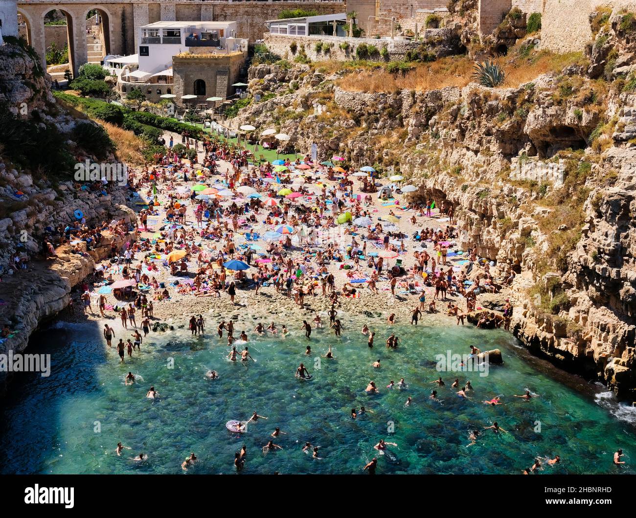 Polignano a Mare, Southern Italy province of Bari - famous beach Lama Monachile between steep cliffs and white buildings Stock Photo