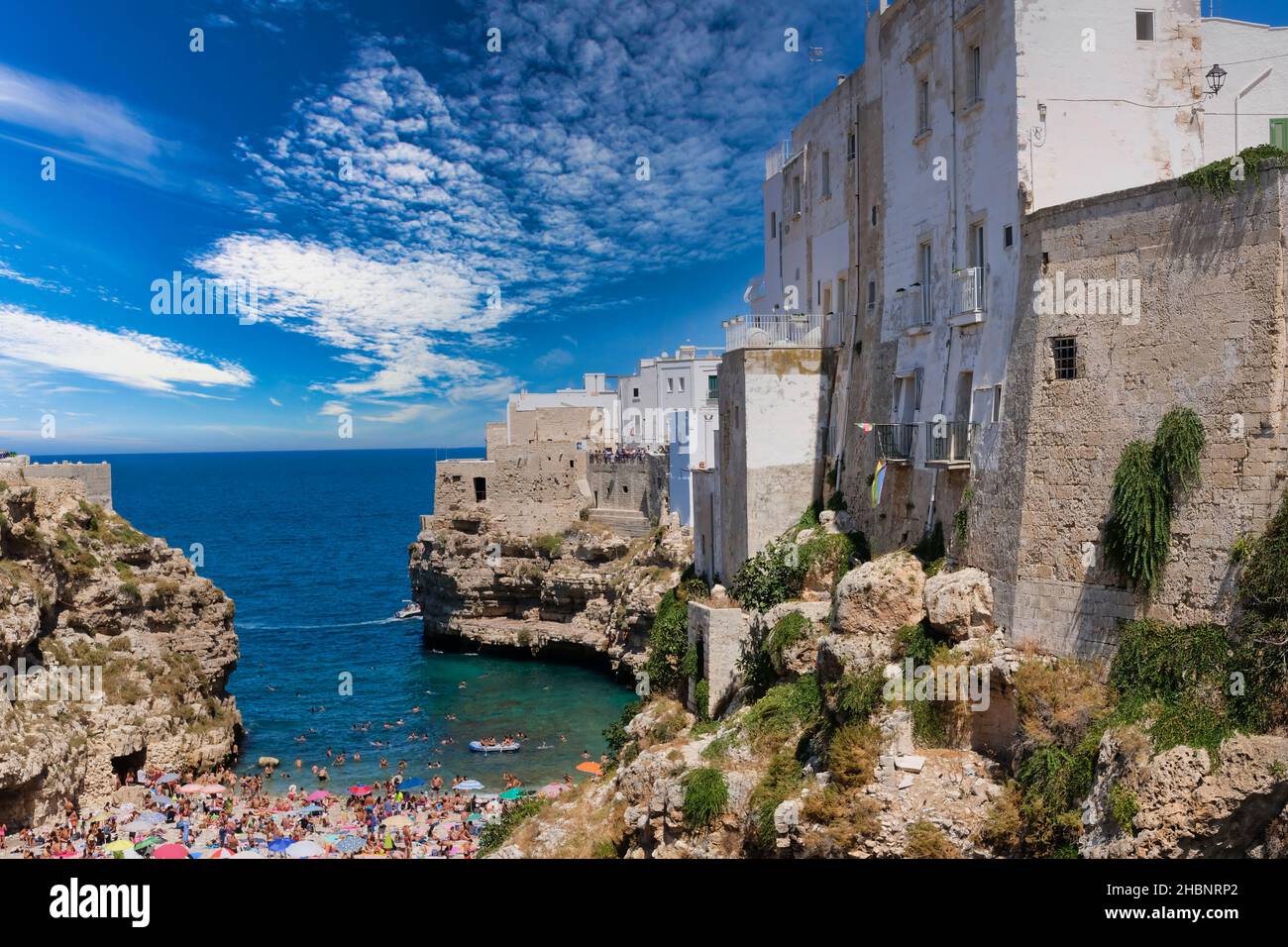 Polignano a Mare, Southern Italy province of Bari - famous beach Lama Monachile between steep cliffs and white buildings Stock Photo