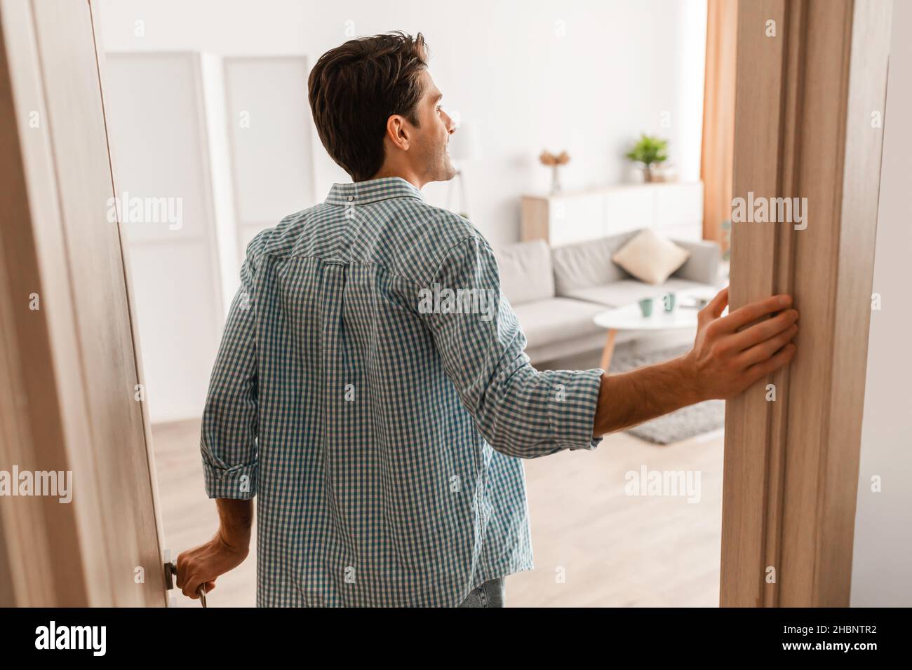 Man walking through door hi-res stock photography and images - Alamy