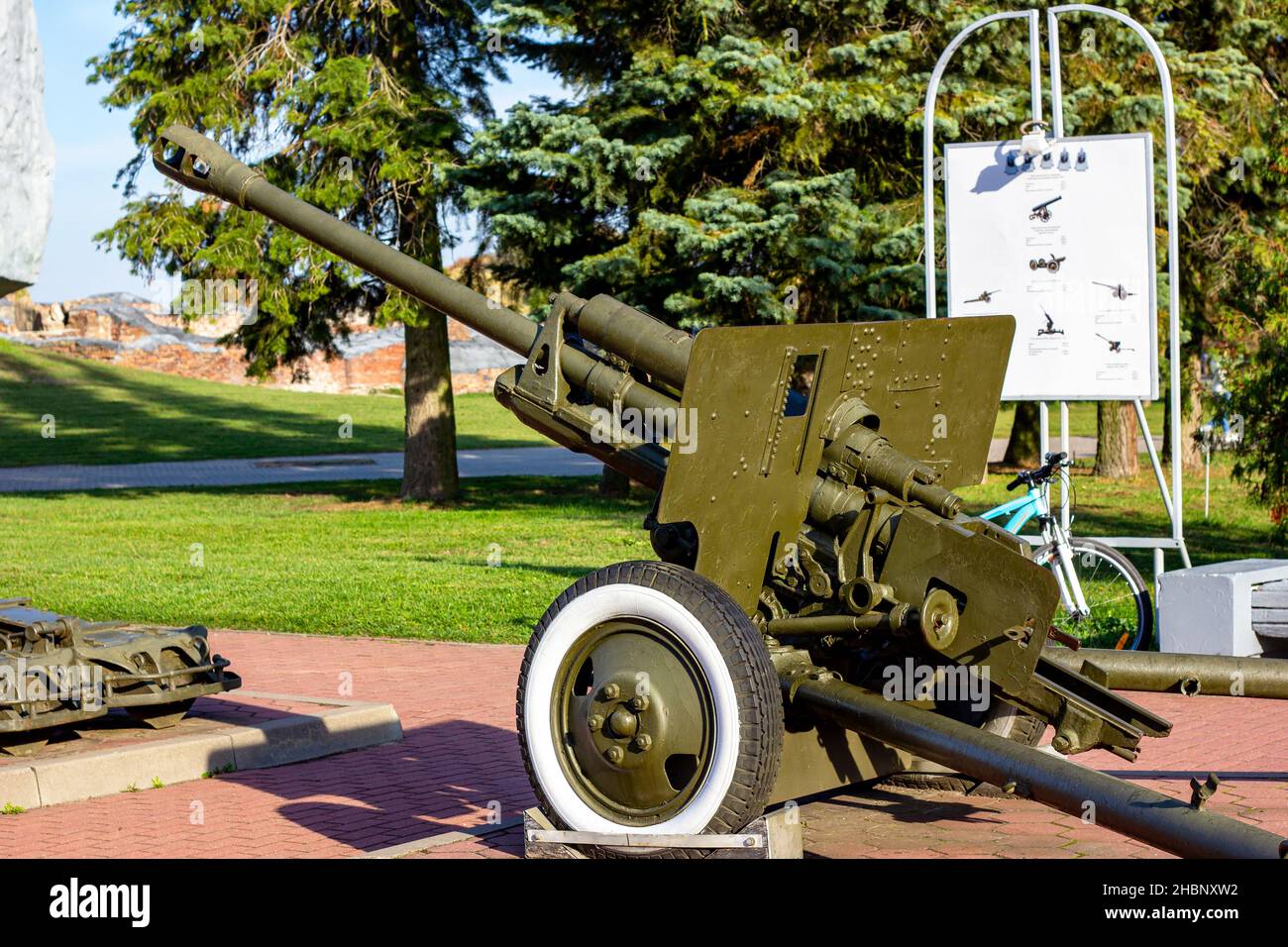 BREST, BELARUS - OCTOBER 18, 2019: Historical artillery gun on the wheels from the World War II age. Close up of a retro military cannon weapon. Stock Photo