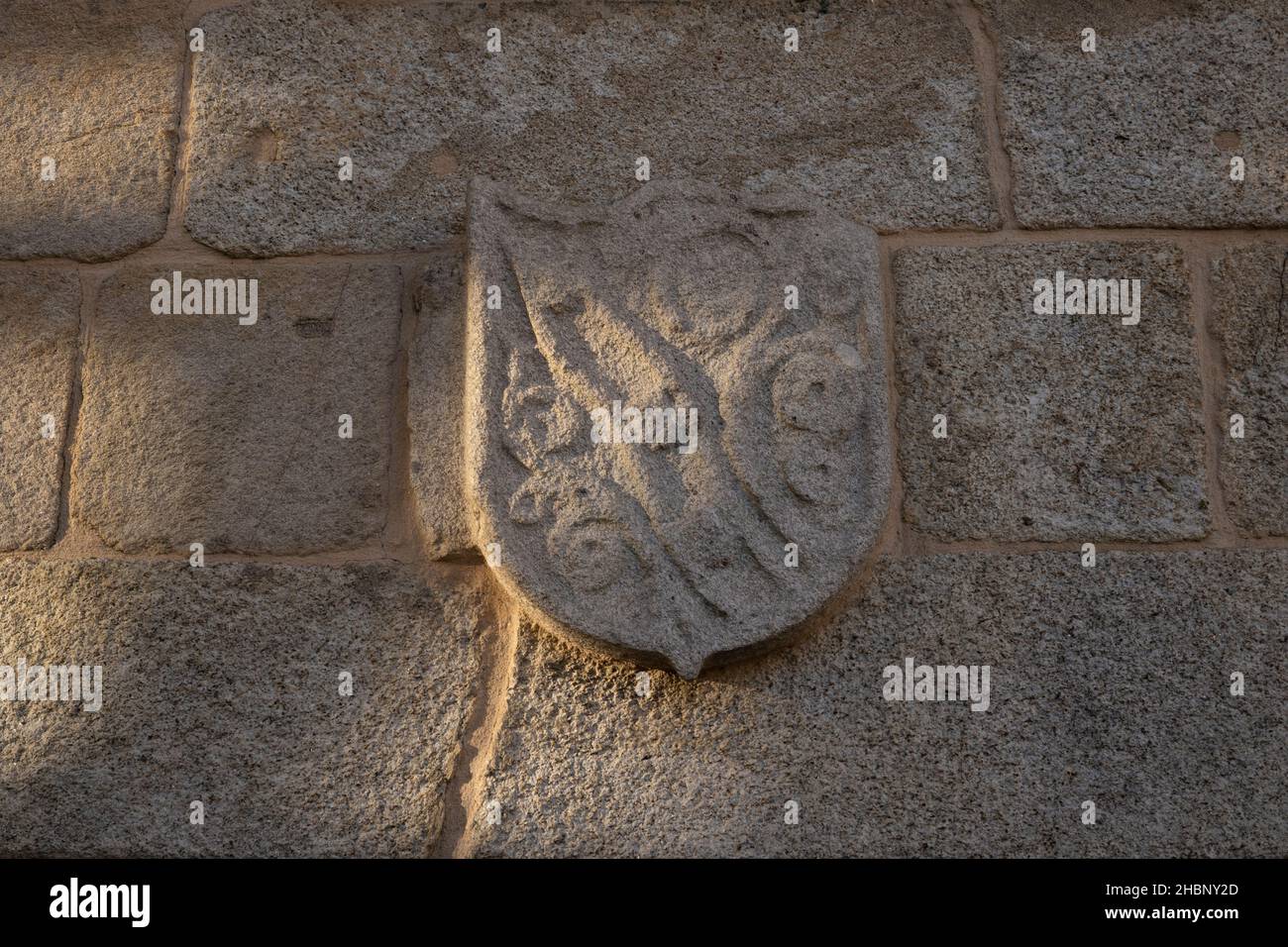 A well-worn coat of arms at the Igreja Matriz Santa Maria la Mayor along the Camino Portuguese in Barcelos, Portugal. This route of the Camino de Sant Stock Photo